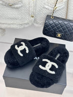 Women's dark navy CHANEL plush slides with white pearl CC logo