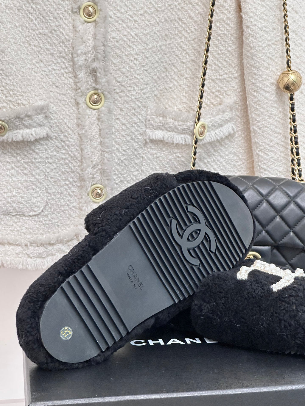 Women's dark navy CHANEL slide sandals with ridged rubber outsole tread