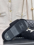 Women's dark navy CHANEL slide sandals with ridged rubber outsole tread