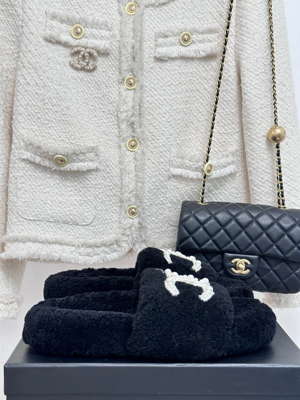 Women's dark navy CHANEL fuzzy slide sandals with pearl CC logo strap