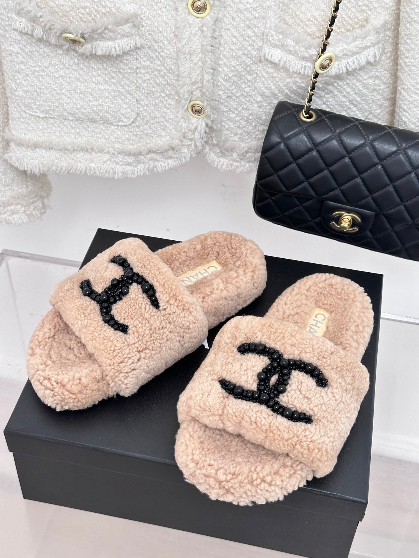 Beige sherpa slides with black beaded logo strap, womens luxury shoes