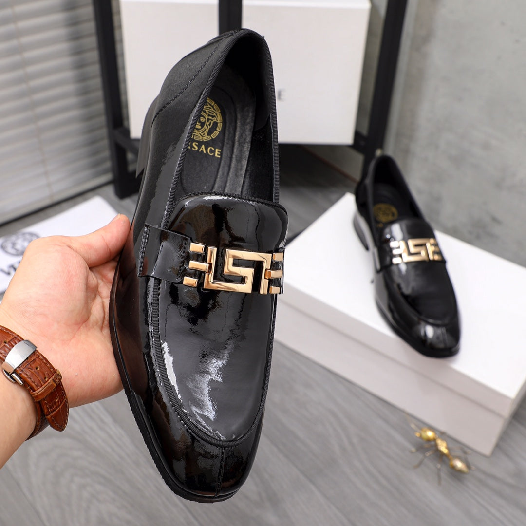 Versace black patent loafer with gold buckle detail across the front