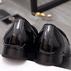 Versace black patent leather loafer heel and back view with glossy finish