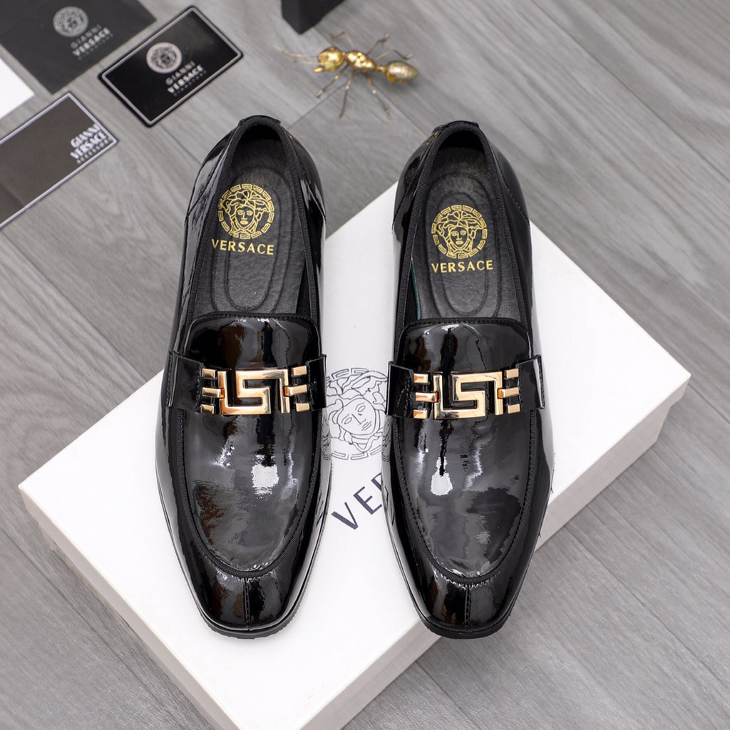 Versace black patent leather loafer with gold logo buckle detail and glossy finish