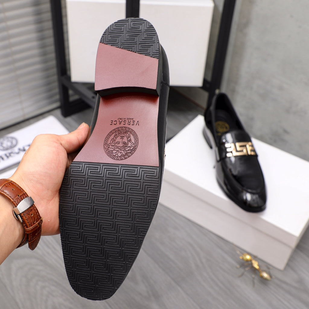 Versace black leather loafer sole and heel underside view