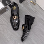 Versace black patent leather loafers with gold buckle detail, front and side views