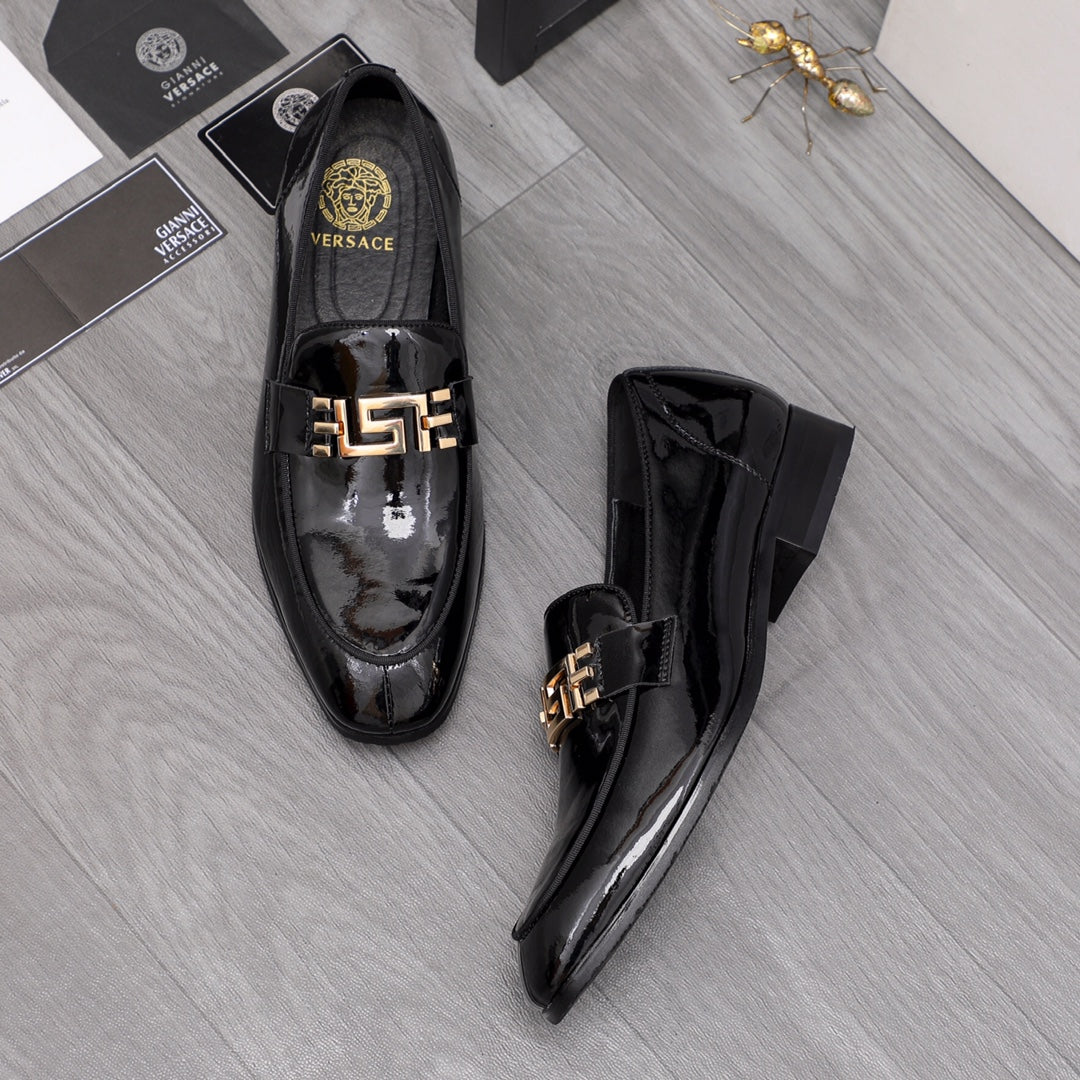 Versace black patent leather loafers with gold buckle detail, front and side views