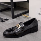 Versace black patent loafer with gold buckle ornament on the vamp