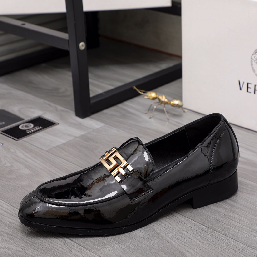 Versace black patent loafer with gold buckle ornament on the vamp
