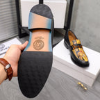 Versace loafer shoes: black textured sole with brand stamp on heel