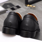 Versace loafer shoes, black leather with rounded heel and stitched seams