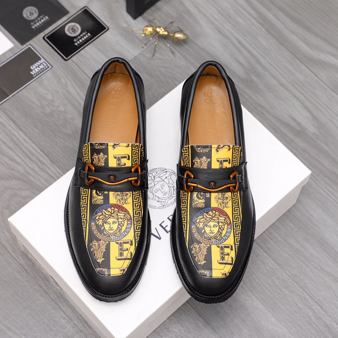 Versace loafer shoes in black with gold patterned panel and gold buckle strap