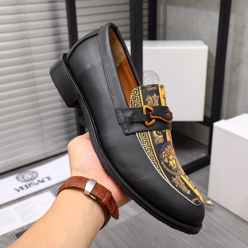 Versace loafer shoe with black leather and gold patterned stripe panel
