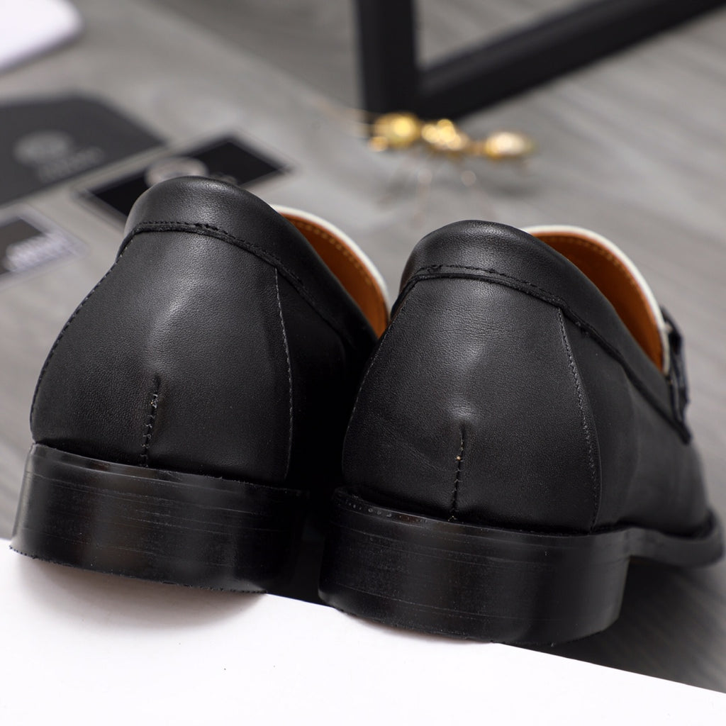 Versace black leather loafers heel view with smooth outsole and stitched seams
