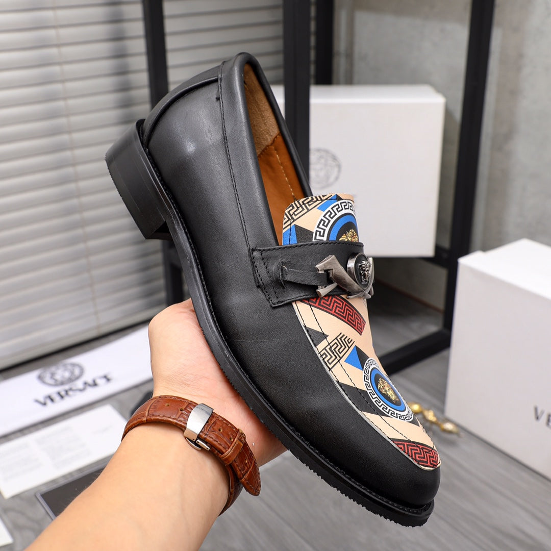 Versace black leather loafer with patterned inlay and metal emblem on strap