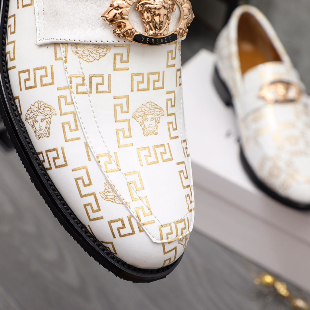 Versace luxury shoes, close-up of white logo loafers with gold crest and stitched strap