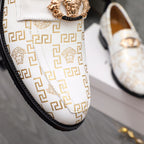 Versace luxury shoes, close-up of white logo loafers with gold crest and stitched strap