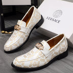 Versace luxury shoes, pair of white patterned loafers with gold crest and black sole