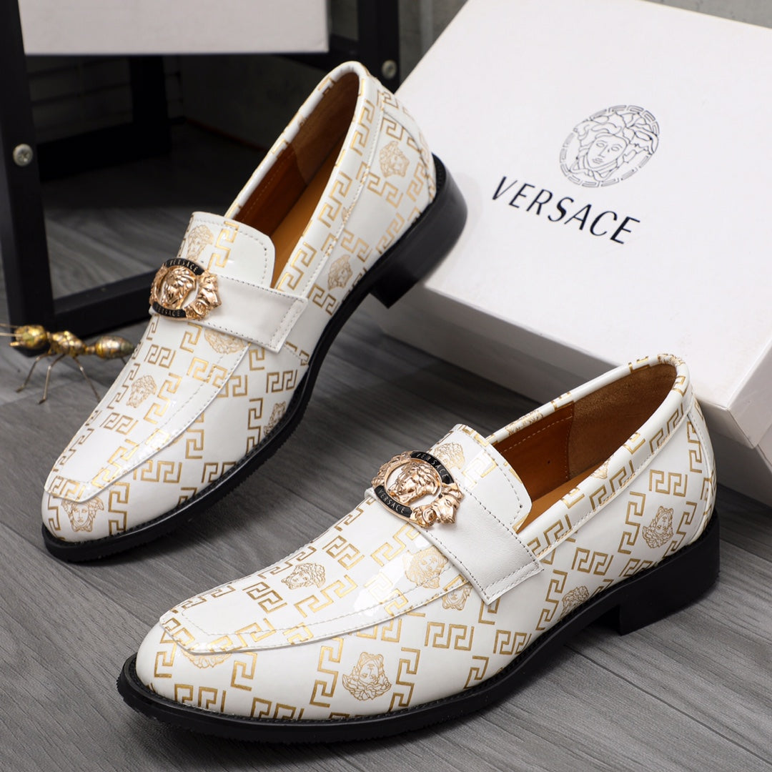 Versace luxury shoes, pair of white patterned loafers with gold crest and black sole