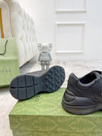 Gucci unisex sneaker outsole view with tread and dark leather heel and logo