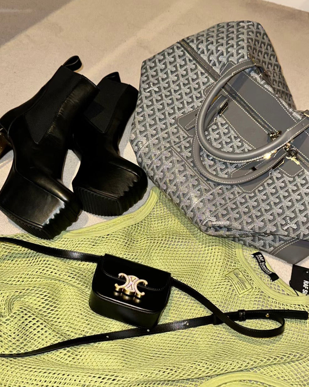 Monogram tote bag with gray-and-dark patterned fabric and silver-tone buckle strap.
