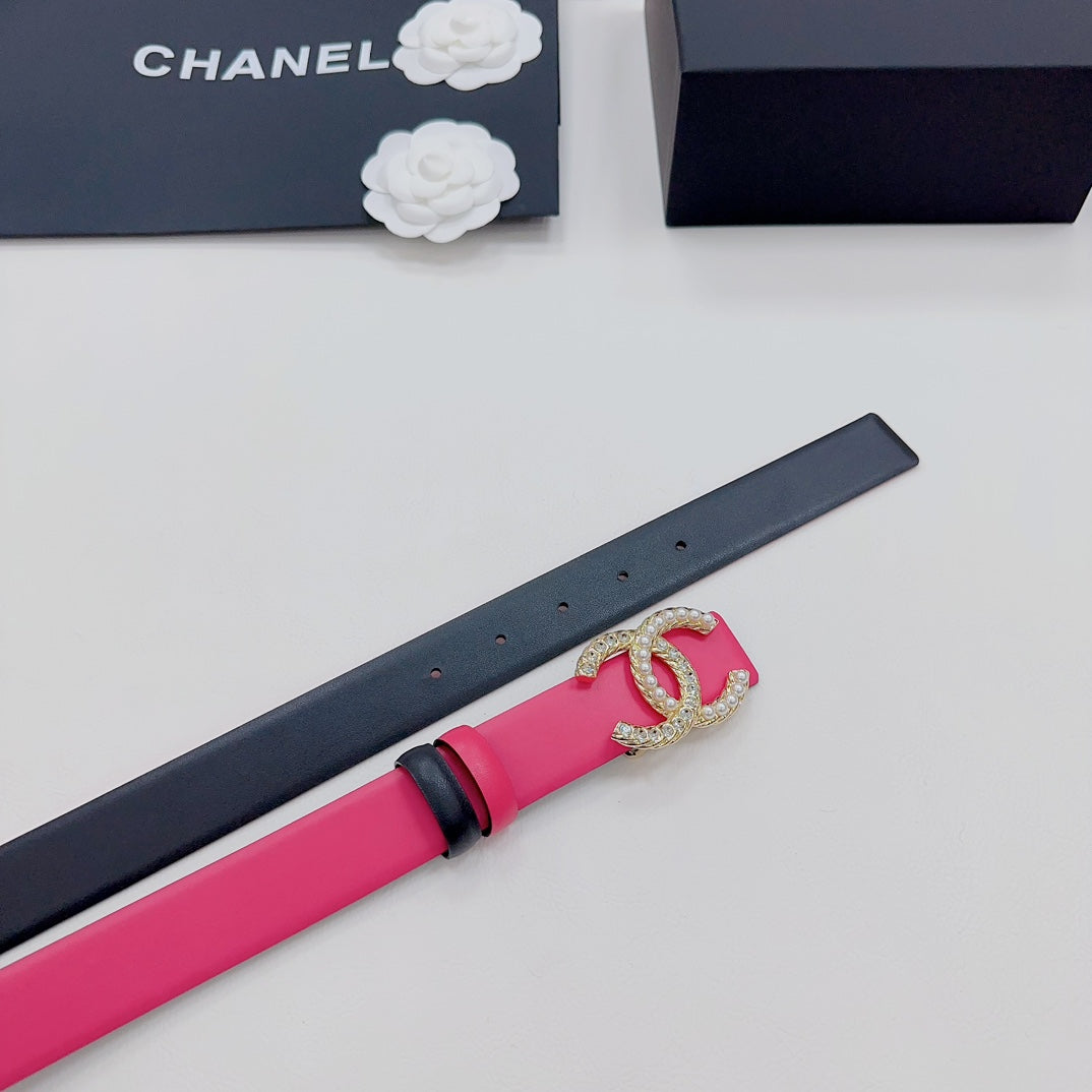 Black and pink leather belt end with gold-tone CC emblem and holes