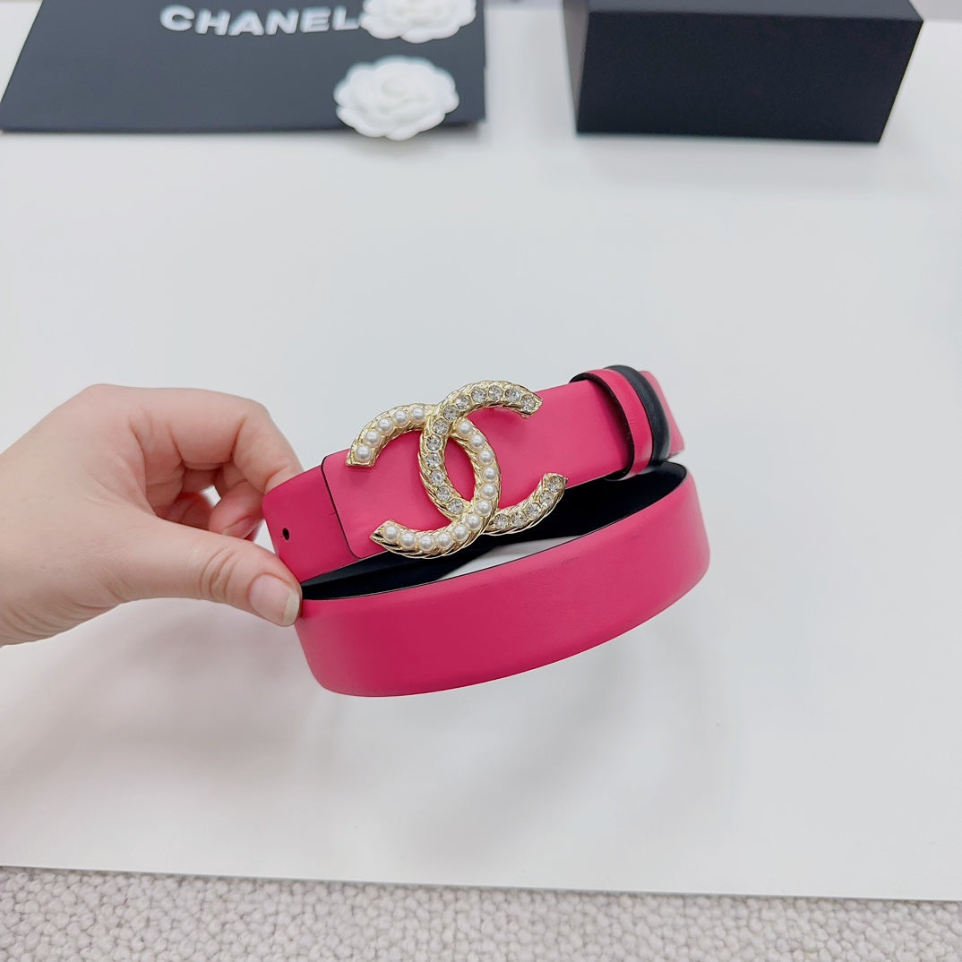 Pink leather belt with gold-tone CC buckle, black strap and rivets