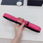 Pink leather belt with gold-tone CC buckle, black accent strap detail
