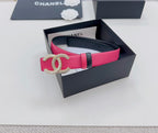 Pink leather belt with gold-tone CC buckle and black side straps