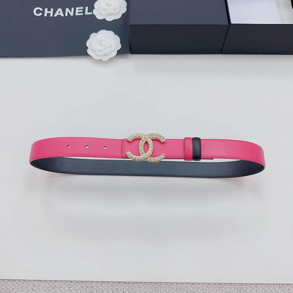 Pink leather belt with gold-tone CC buckle and black underside