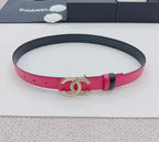 Pink belt with black underside and gold-tone CC buckle, adjustable holes