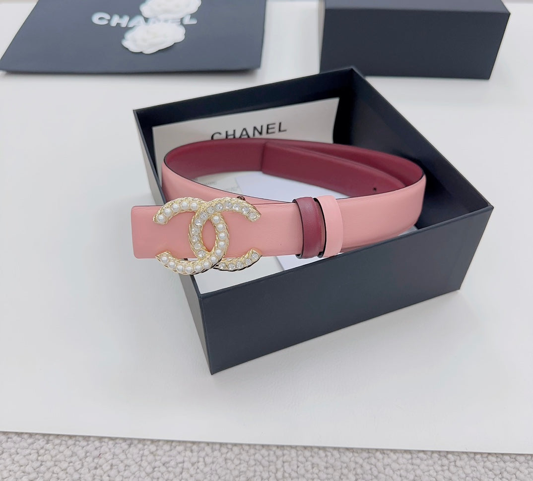 Pink Chanel belt with gold-tone CC buckle, jeweled detail, and two-tone keeper straps
