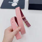 Pink Chanel belt with gold-tone buckle hardware and stacked keeper strap