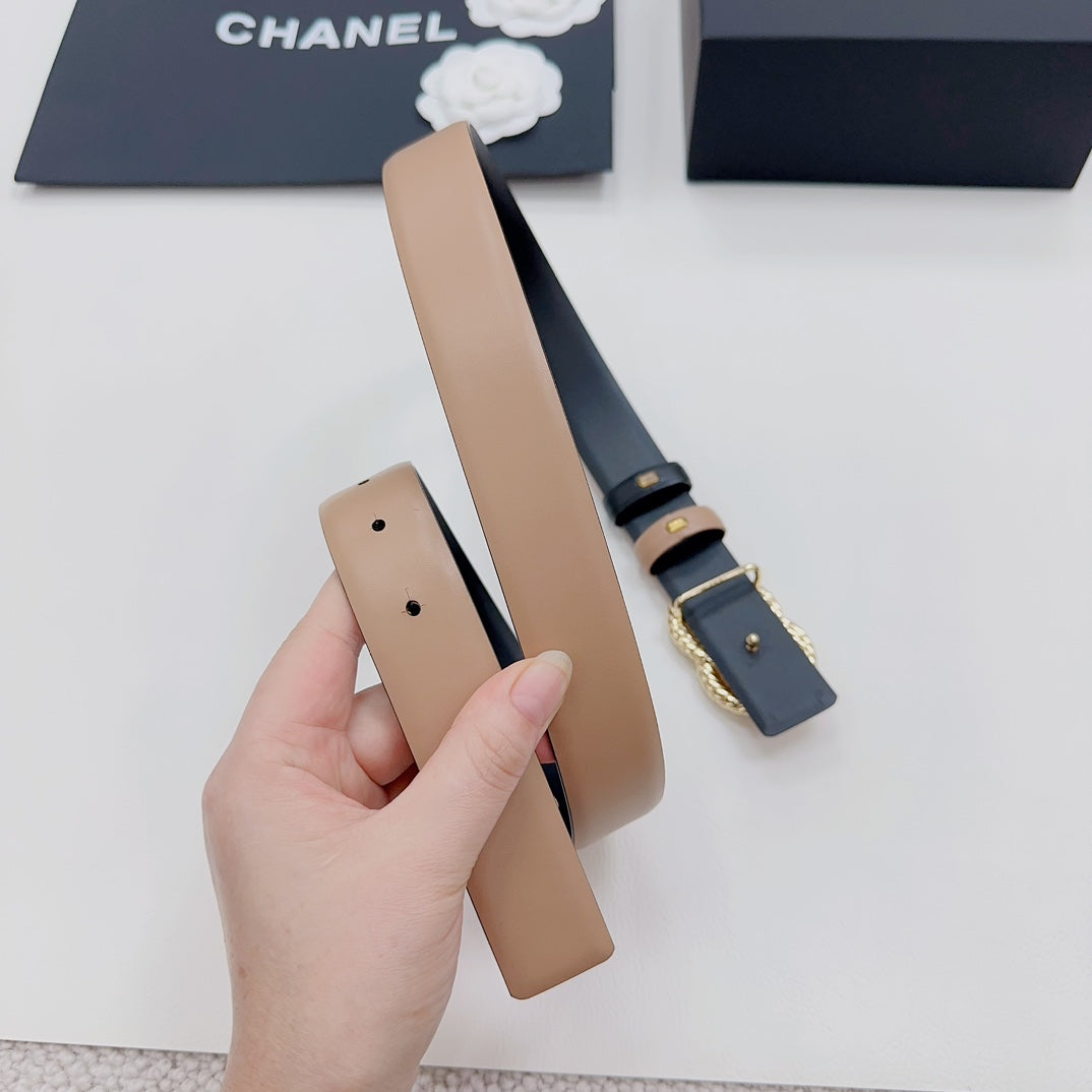 Tan belt with navy end panel and gold-tone double-C charm detail