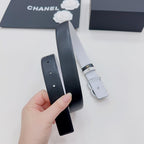 Dark leather belt with strap end hardware and adjustment holes