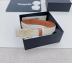 Chanel belt in light beige with gold-tone CC buckle and orange leather trim.
