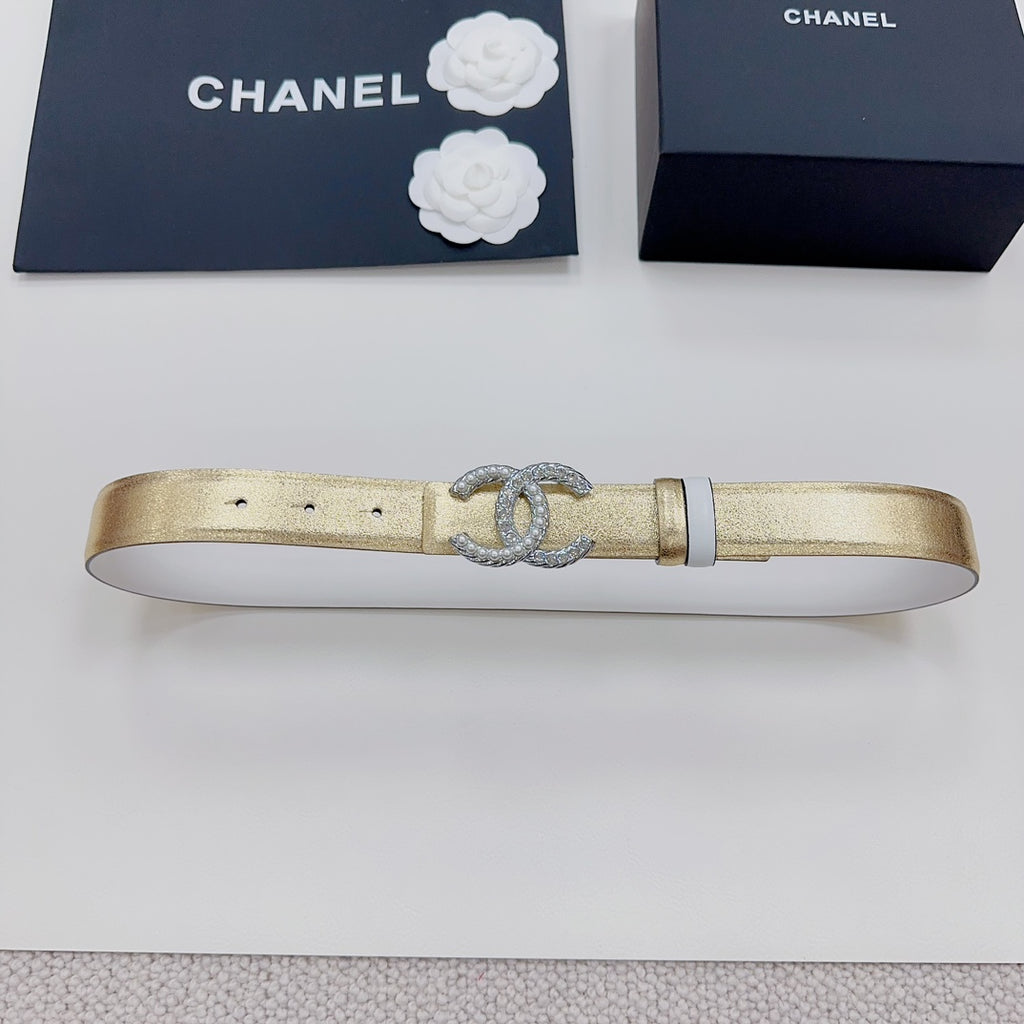 Gold-tone belt with silver CC rhinestone buckle and black end tabs