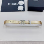 Gold-tone belt with silver CC rhinestone buckle and black end tabs