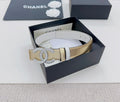 Gold-tone belt with silver CC rhinestone buckle and black accent stripe