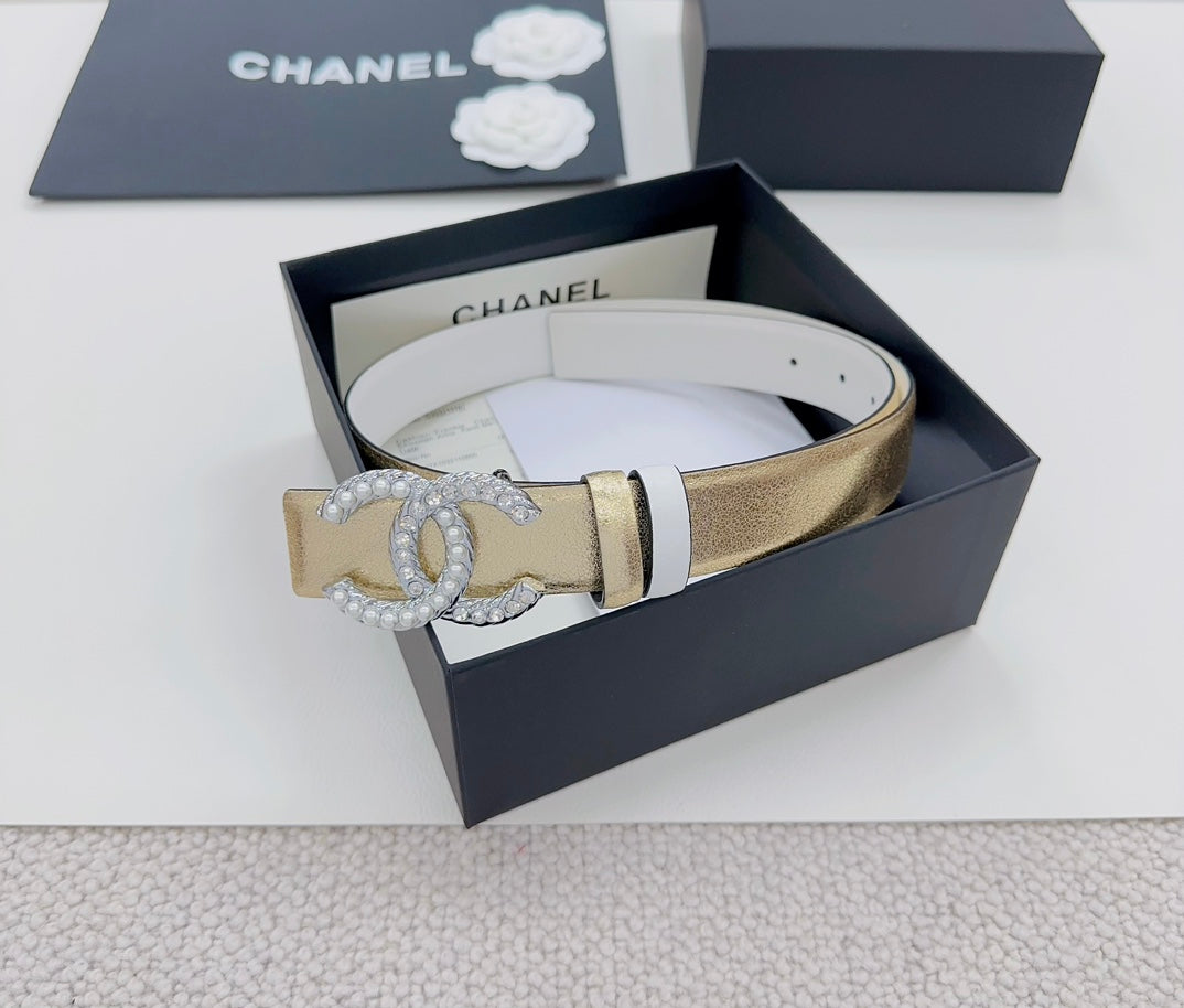 Gold-tone belt with silver CC rhinestone buckle and black accent stripe