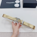 Gold-tone belt with silver CC rhinestone buckle detail and black striped end