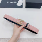 Pink leather belt with dark underside strap and gold faux-pearl double C buckle