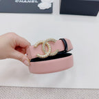 Pink belt end with gold faux-pearl double C emblem and dark accent trim