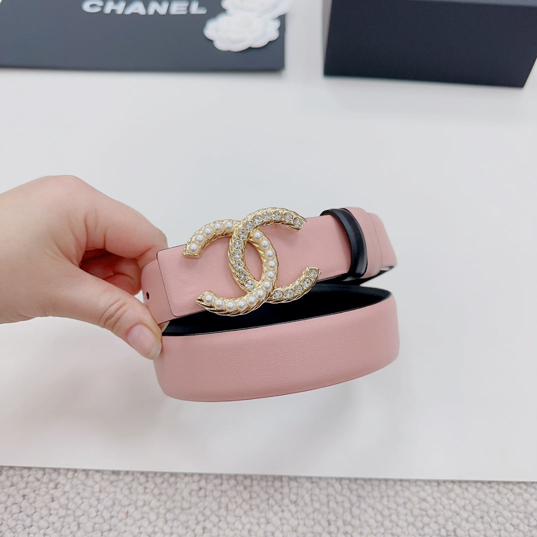 Pink belt end with gold faux-pearl double C emblem and dark accent trim