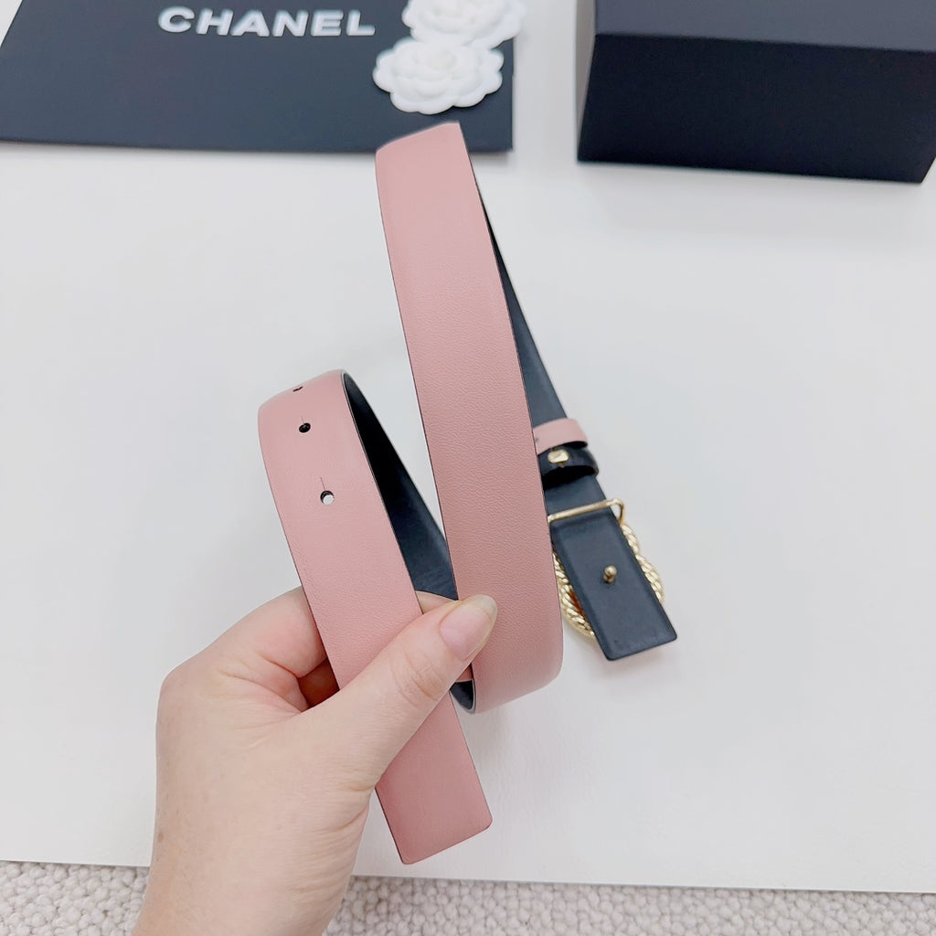 Pink leather belt with dark metal buckle and pin, plus gold faux-pearl double C detail