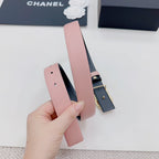 Pink leather belt with dark metal buckle and pin, plus gold faux-pearl double C detail