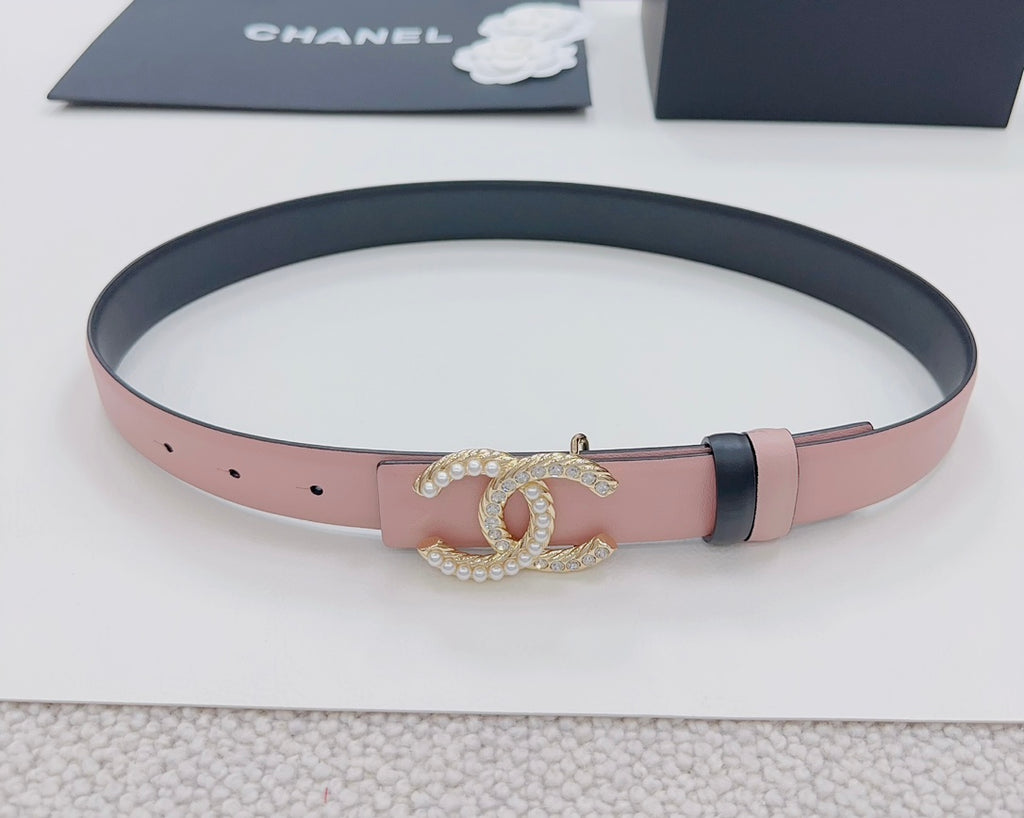 Pink leather belt with dark edge, gold faux-pearl double C buckle, and punched holes