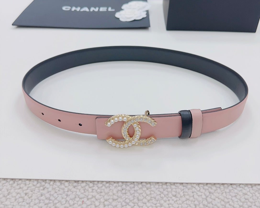 Pink leather belt with dark edge, gold faux-pearl double C buckle, and punched holes