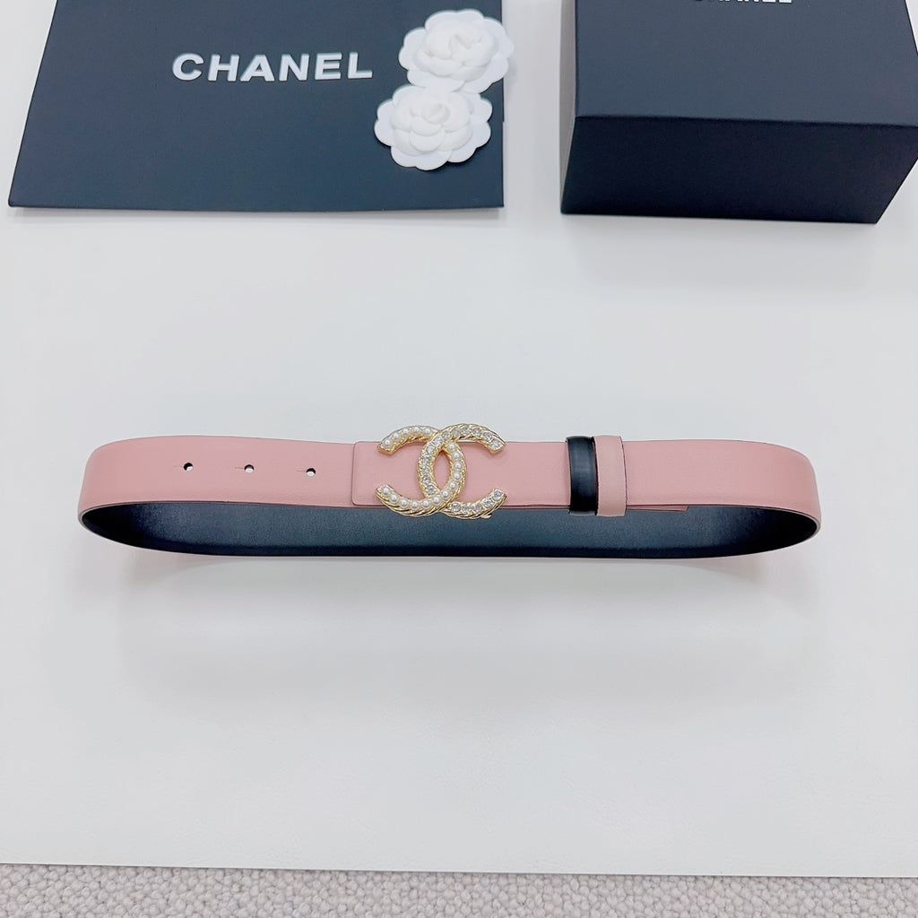 Pink belt with gold faux-pearl double C buckle, dark side band, and punched holes