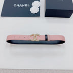 Pink belt with gold faux-pearl double C buckle, dark side band, and punched holes